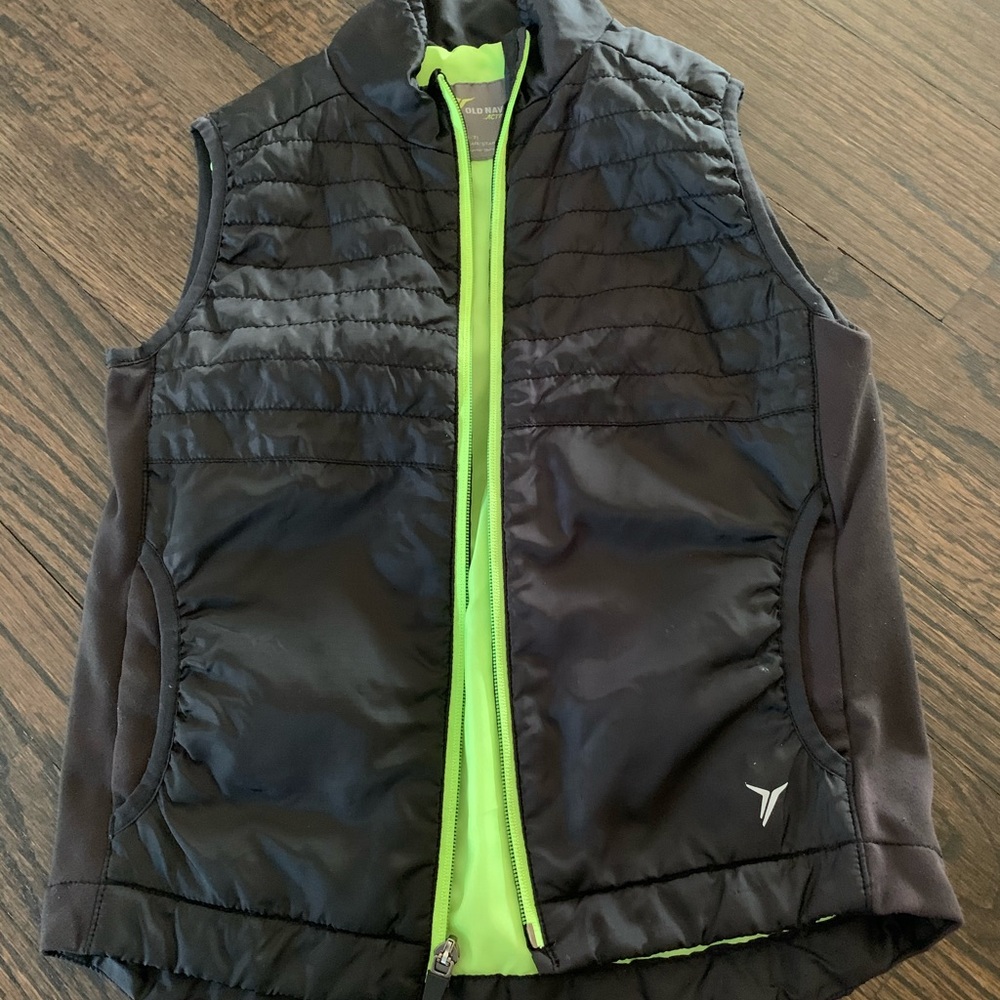 Black vest with neon green zipper, great quality